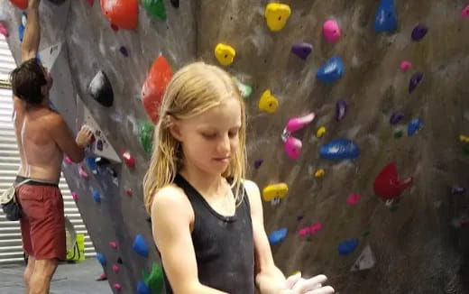 a person climbing a rock wall