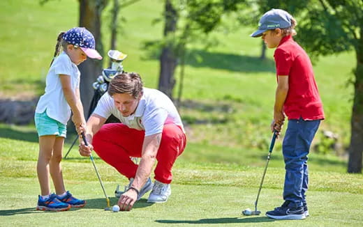 a group of people playing golf