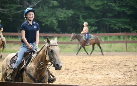 a group of people riding horses