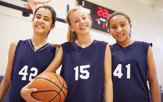 a group of women in basketball uniforms