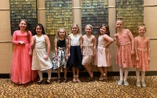 a group of women posing for a photo