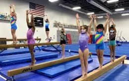 a group of girls jumping on a trampoline