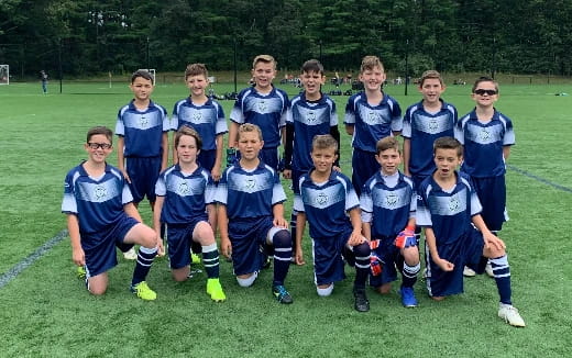 a group of boys in blue uniforms