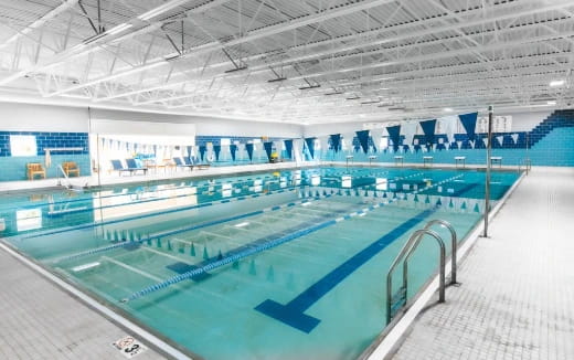 a swimming pool in a large indoor swimming pool