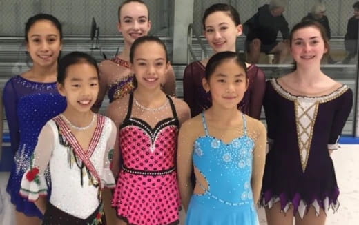 a group of women posing for a photo