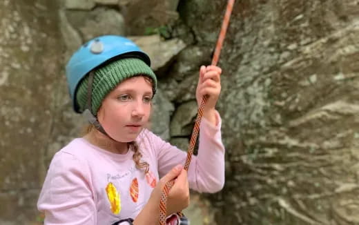 a girl holding a stick