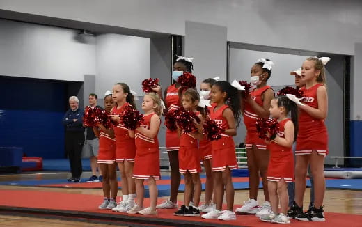 a group of cheerleaders on a stage