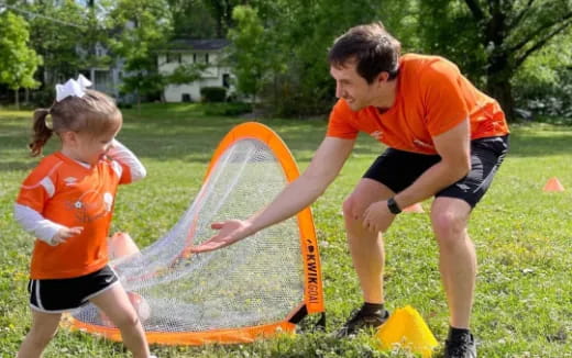 a person and a girl playing with a kite