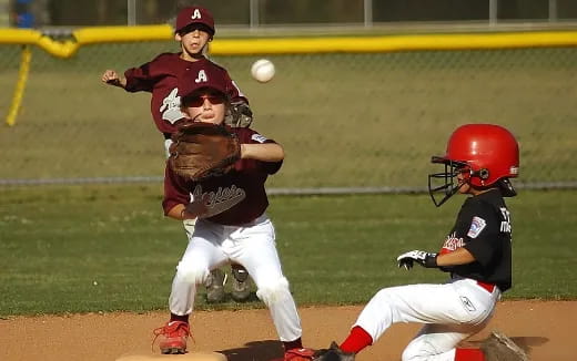 a couple of kids playing baseball