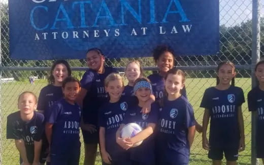 a group of girls in blue uniforms