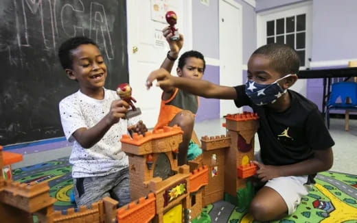 a group of kids playing with toys