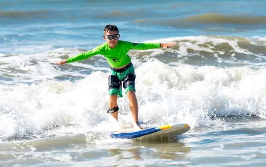 a person surfing on the waves