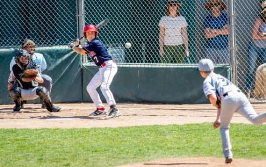 a baseball player swinging a bat