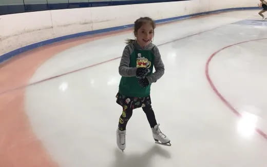 a young boy ice skating