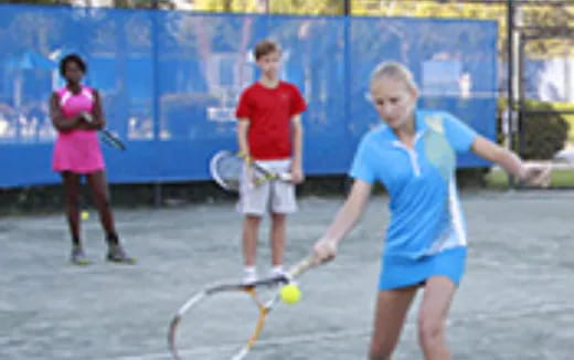 a girl playing tennis