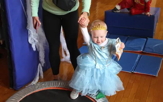 a child in a blue dress