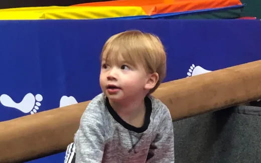 a boy sitting on a couch