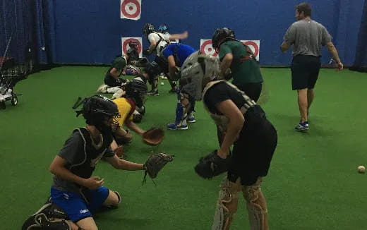 a group of people playing baseball