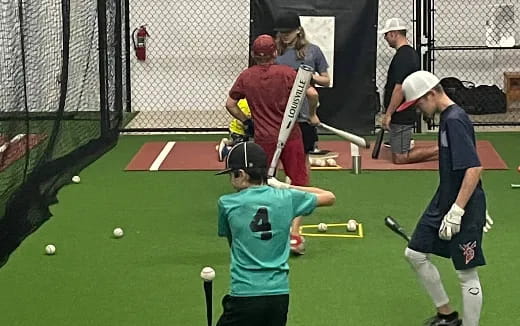 a group of people playing cricket