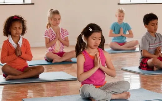 a group of children sitting on the floor