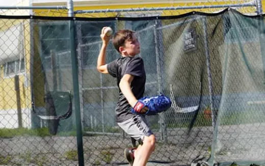 a boy is playing baseball