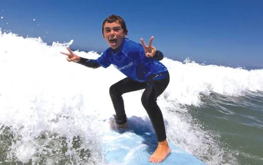 a man surfing on a wave