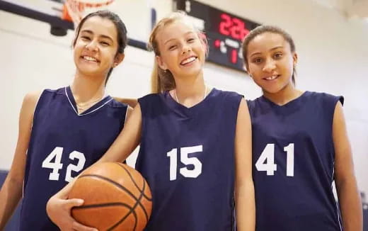 a group of women in basketball uniforms