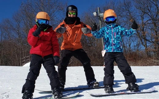 a group of people on snowboards