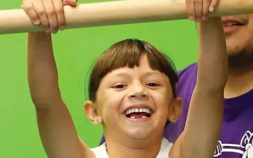 a young girl smiling