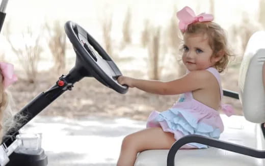 a little girl playing with a toy