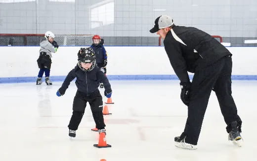 a person and a child ice skating