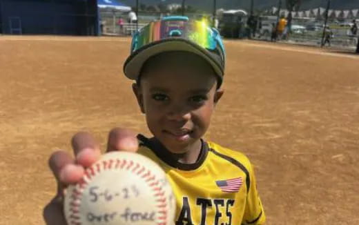 a child holding a ball