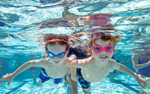 a group of people in a pool