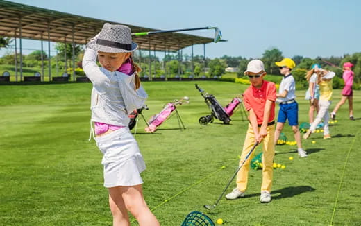 a group of people playing golf