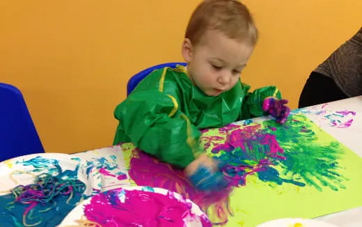 a child sitting at a table