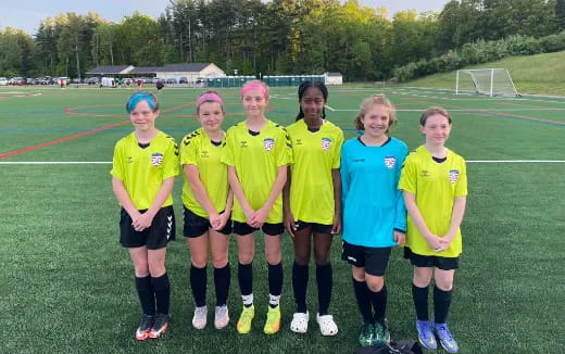 a group of girls in football uniforms
