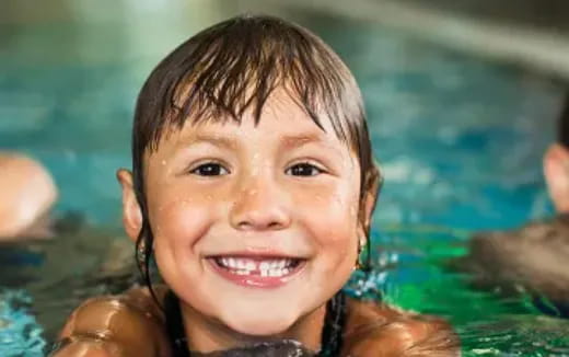 a close-up of a girl smiling