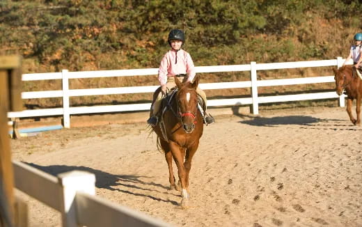 a girl riding a horse