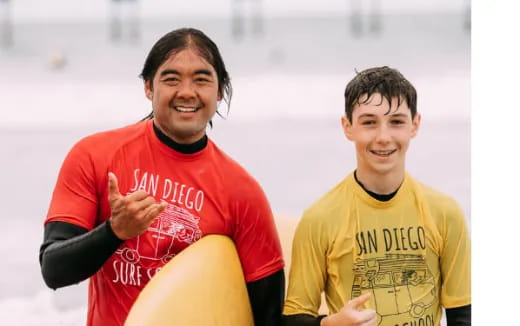 a couple of men smiling