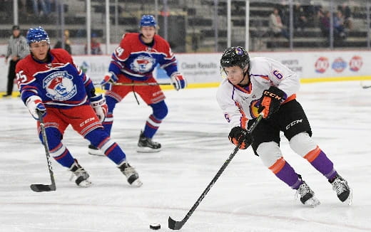 a group of men playing hockey