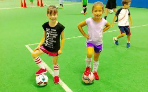 a group of kids playing football
