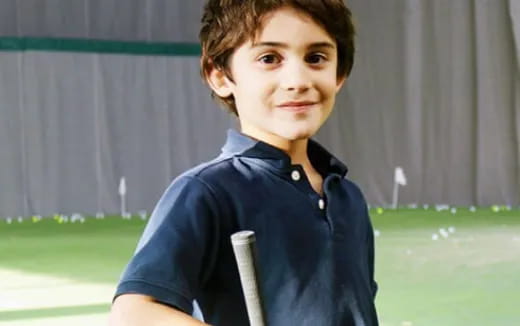 a boy smiling for the camera