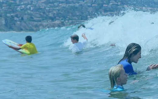 people swimming in the ocean