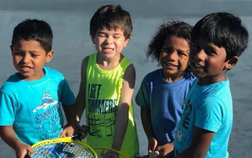 a group of boys posing for a picture