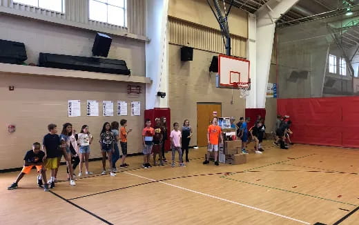 a group of people playing basketball