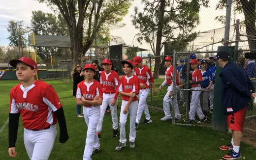 a group of kids in red uniforms