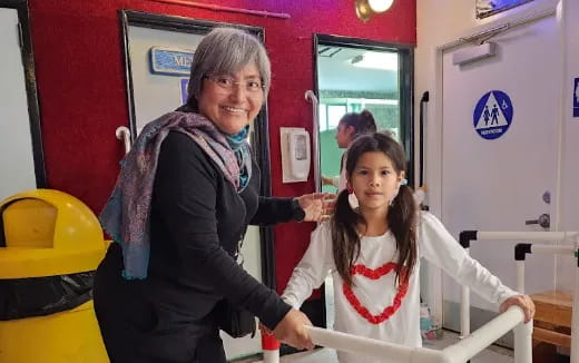 a person and a girl in a room