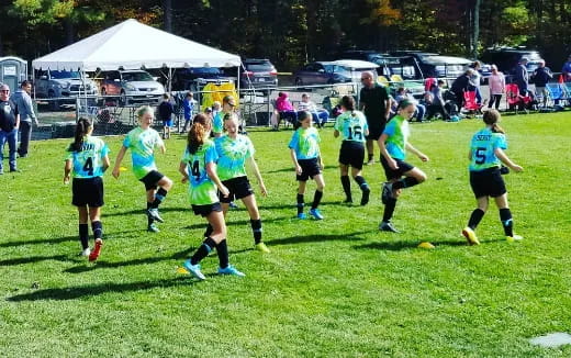 a group of girls playing football