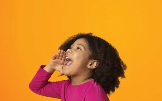 a young girl with her hand on her face