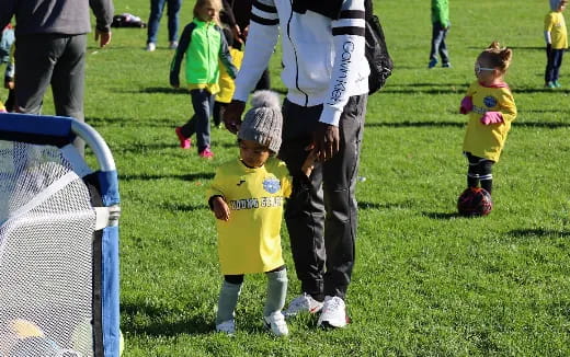 a person and a child on a field